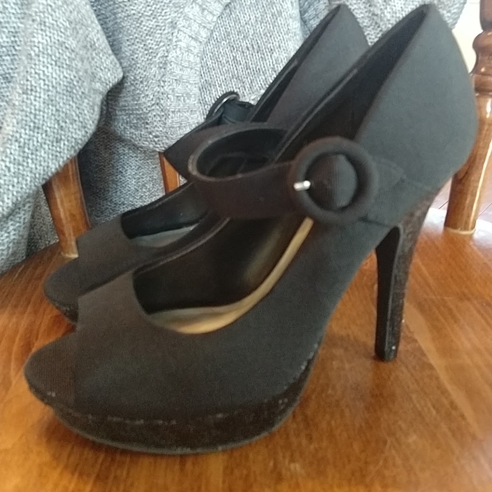 Platform heels with buckle strap.
